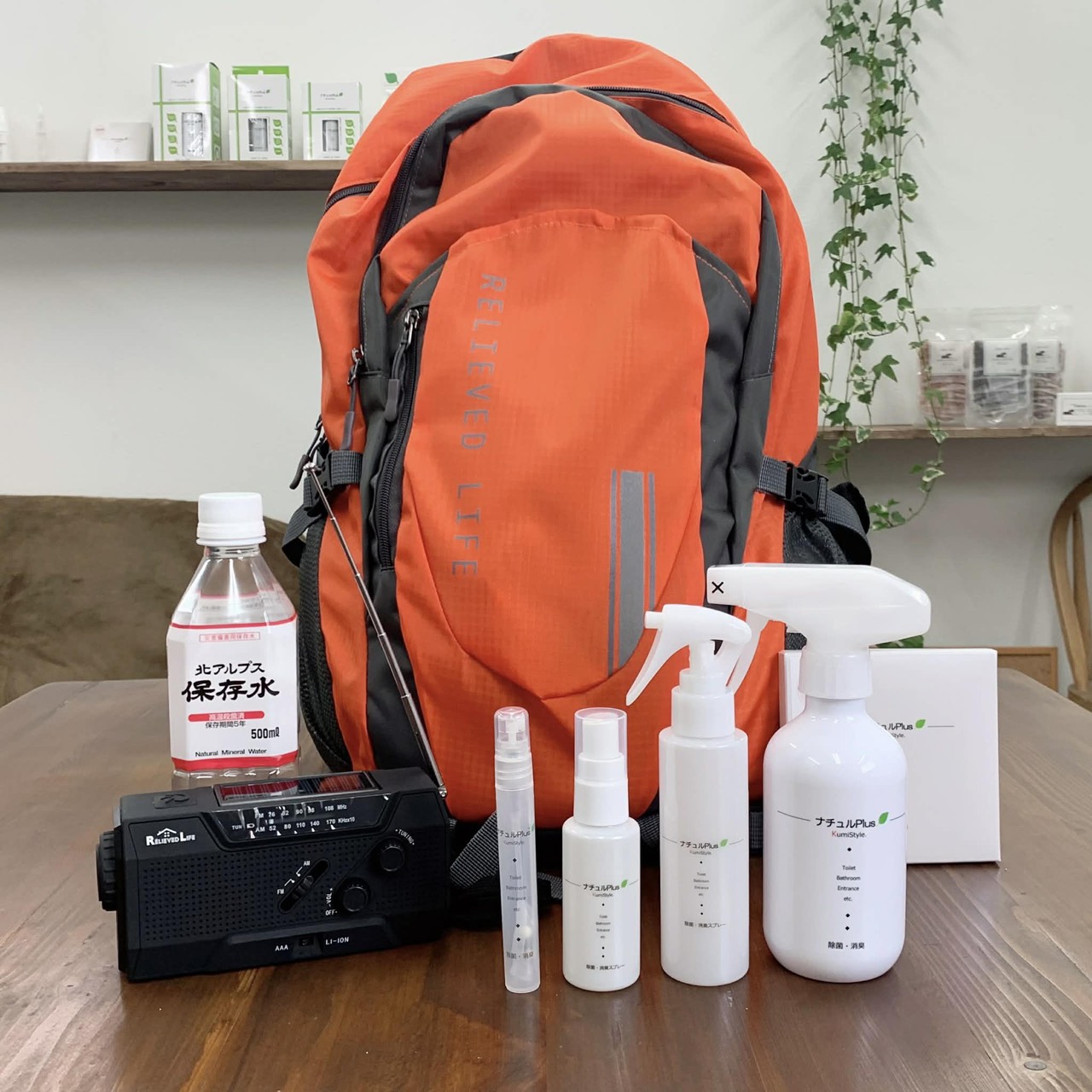 NATURU Plus beads packed in an emergency kit with stored water and a hand-crank radio